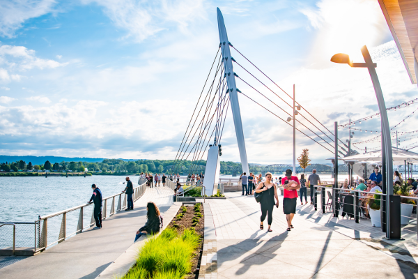 people enjoying waterfront and pier