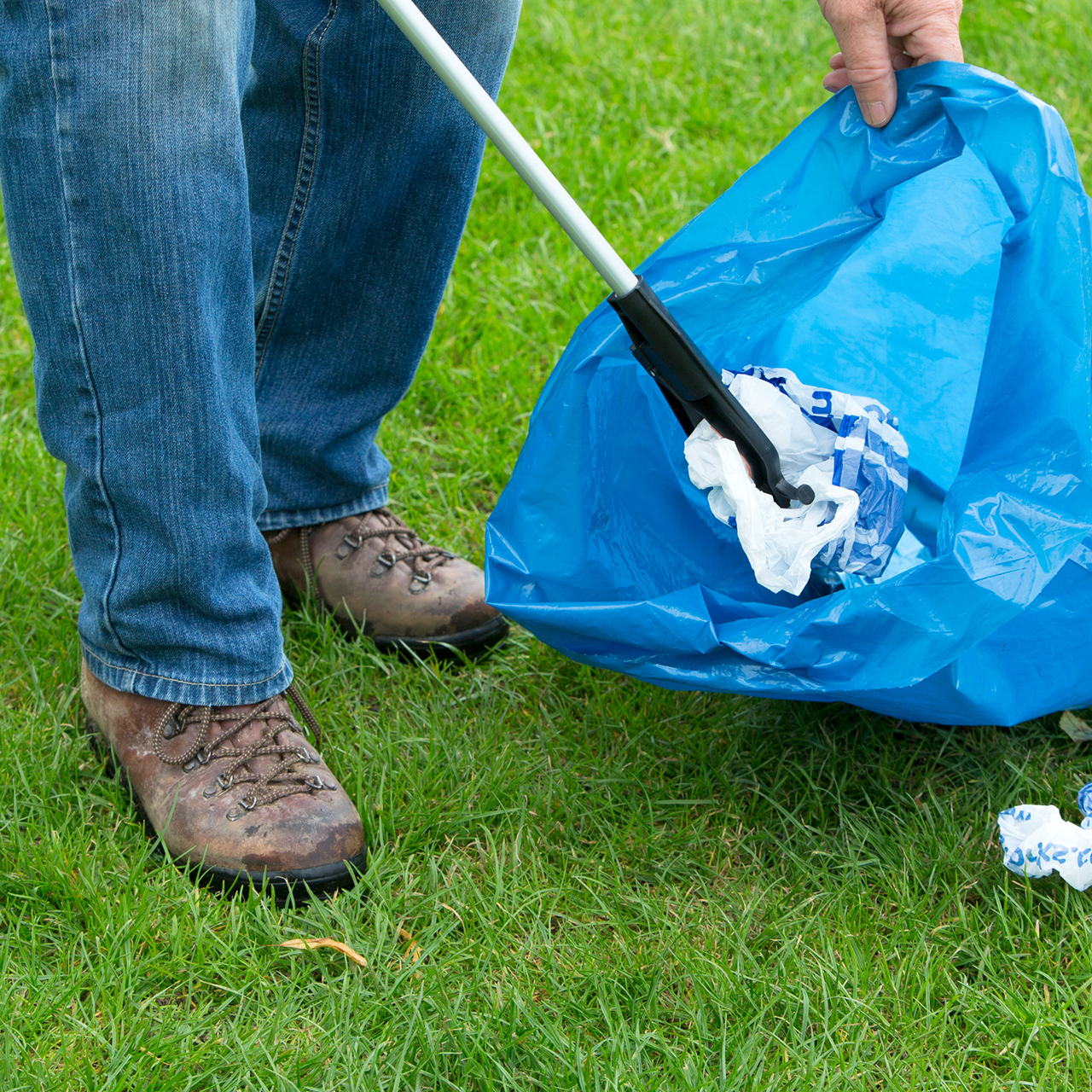 collecting litter with litter-picker and bag