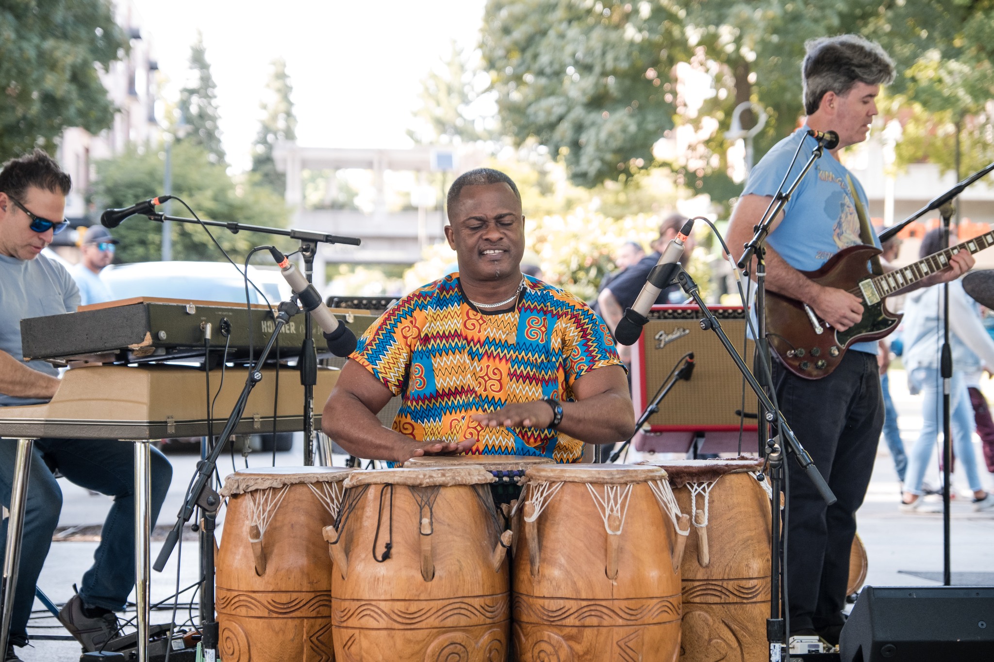 Afrobeat band Jujuba plays music on the Esther Short Park stage featuring drums, guitar and keyboard.
