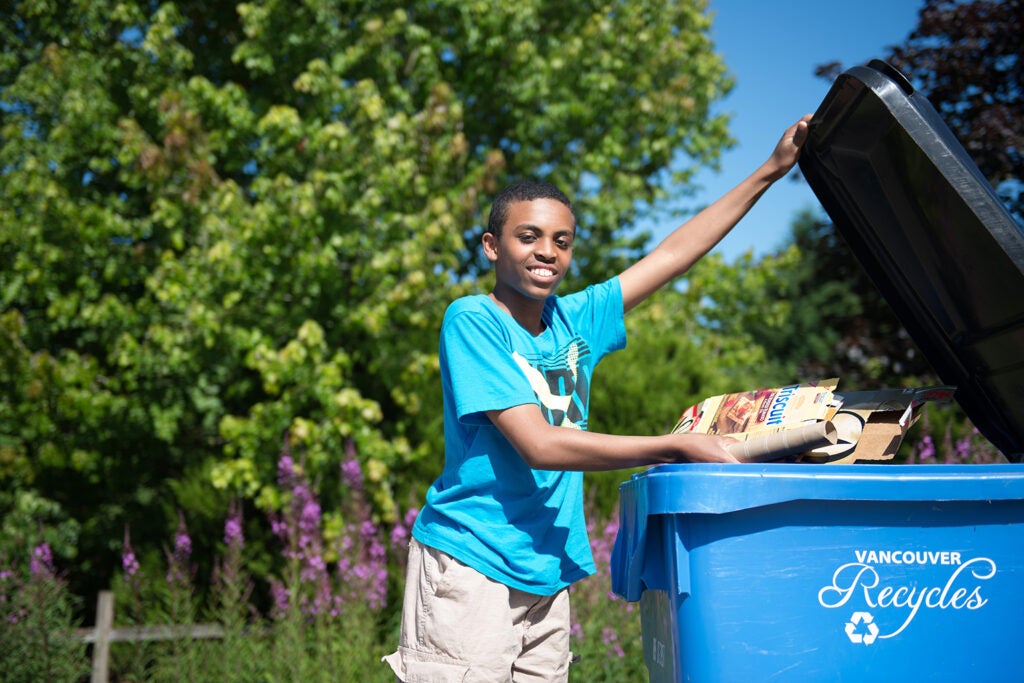 Tossing items into and recycle cart and recycling properly