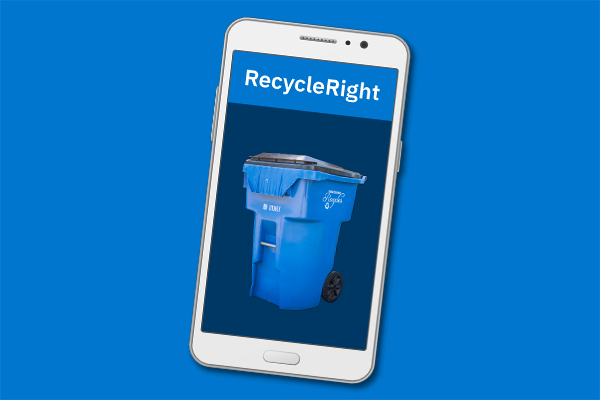 A phone with the RecycleRight application open with a blue Recycle Cart against a dark blue background