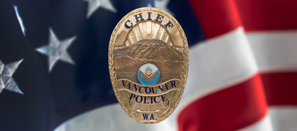 Vancouver WA Police Chief Badge over the top of a flag of the United States